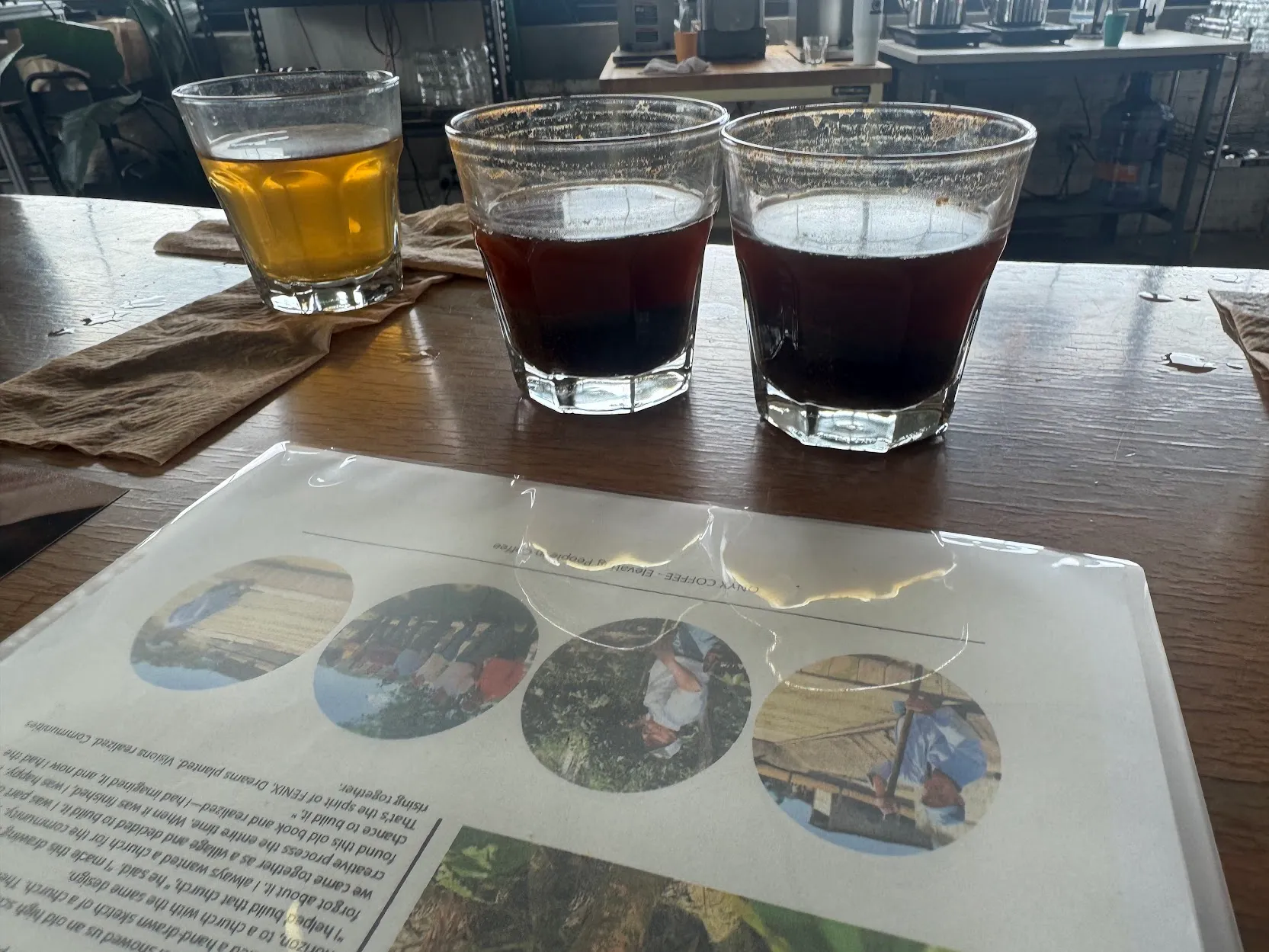 Close up of 2 of the tasting cups with some of the info sheet in frame
